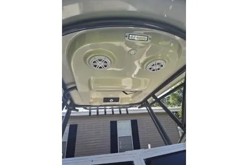 Slide: The Image of 1989 Shamrock 200 Cuddy boat interior ceiling with speakers and light fixtures. - 8