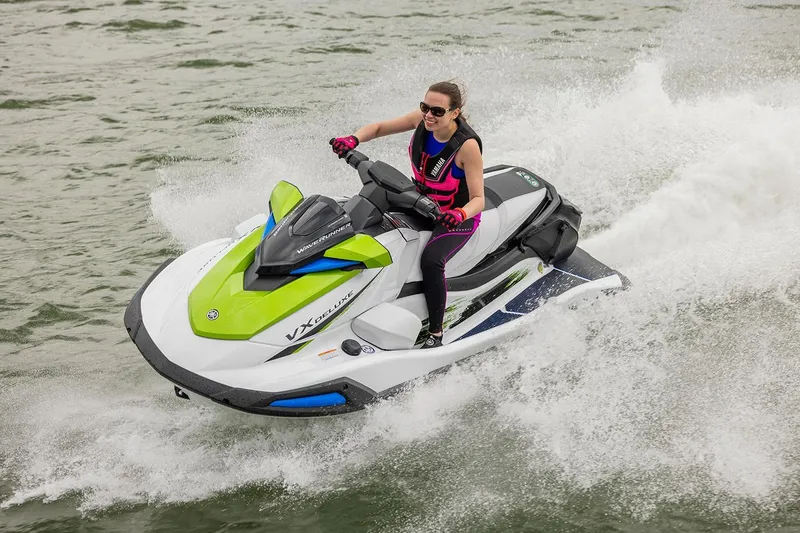 Slide: The Image of Manufacturer Provided Image: Two people enjoying a ride on a 2026 Yamaha WaveRunner VX Deluxe jet ski. - 2