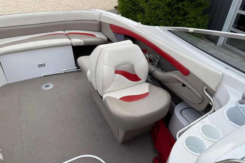 Slide: The Image of 1996 Four Winns 240 HORIZON DLX boat interior with red and white seating. - 11