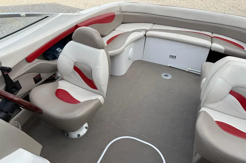 Slide: The Image of Interior of a 1996 Four Winns 240 Horizon DLX boat with red and beige seating. - 12