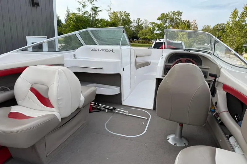Slide: The Image of 1996 Four Winns 240 HORIZON DLX boat interior with seating and dashboard. - 14
