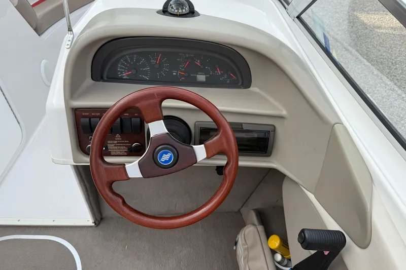 Slide: The Image of Steering wheel and dashboard of 1996 Four Winns 240 HORIZON DLX boat. - 16