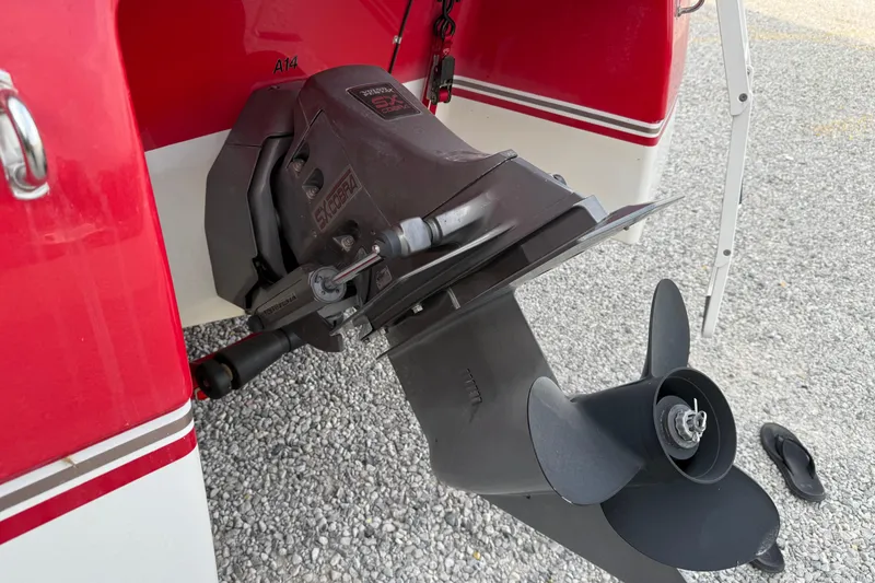 Slide: The Image of 1996 Four Winns 240 HORIZON DLX boat outboard motor and propeller detail. - 17