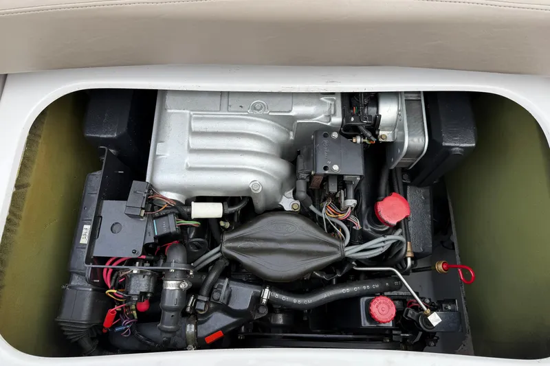 Slide: The Image of Engine compartment of a 1996 Four Winns 240 HORIZON DLX boat. - 19