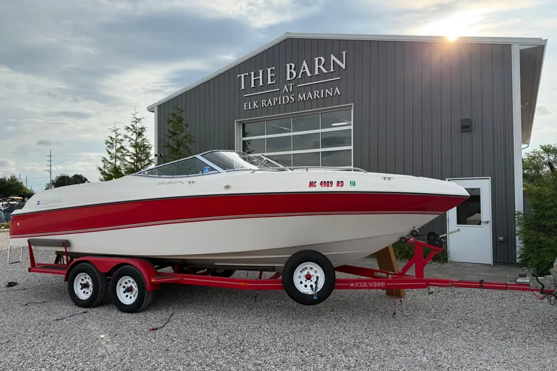 Slide: The Image of 1996 Four Winns 240 Horizon DLX boat on trailer at Elk Rapids Marina. - 2