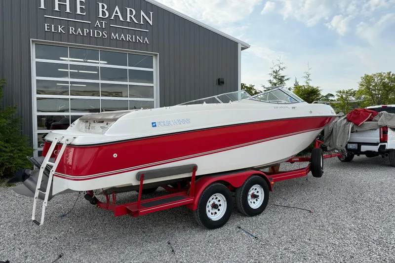 Slide: The Image of 1996 Four Winns 240 Horizon DLX boat on trailer at Elk Rapids Marina. - 4