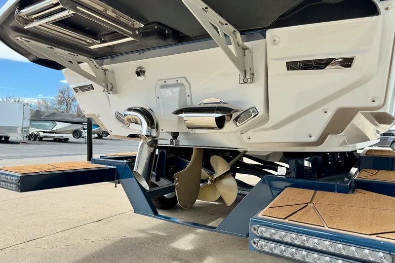 Slide: The Image of 2025 Nautique Super Air Nautique G25 Paragon boat stern with propeller and exhaust system. - 10