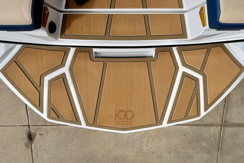 Slide: The Image of 2025 Nautique Super Air Nautique G25 Paragon Centennial Edition deck with teak-style finish. - 13