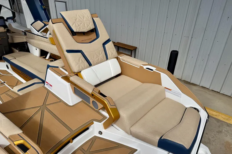 Slide: The Image of Luxurious seating on 2025 Nautique Super Air Nautique G25 Paragon boat, featuring elegant design. - 16