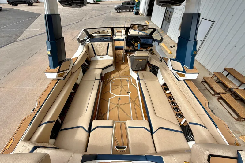 Slide: The Image of 2025 Nautique Super Air Nautique G25 Paragon interior with luxurious seating and modern design. - 18