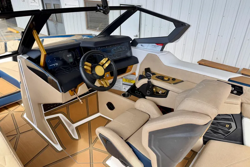 Slide: The Image of Interior of 2025 Nautique Super Air Nautique G25 Paragon boat, featuring modern dashboard and controls. - 19