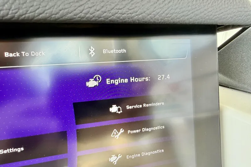 Slide: The Image of 2025 Nautique Super Air Nautique G25 Paragon display showing 27.4 engine hours and diagnostics. - 23