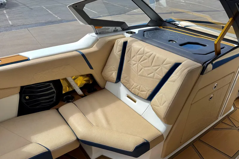 Slide: The Image of 2025 Nautique Super Air Nautique G25 Paragon interior with beige seating and modern design. - 24