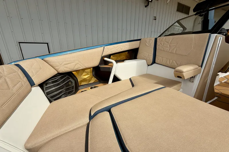 Slide: The Image of 2025 Nautique Super Air Nautique G25 Paragon interior with beige upholstery and modern design. - 29