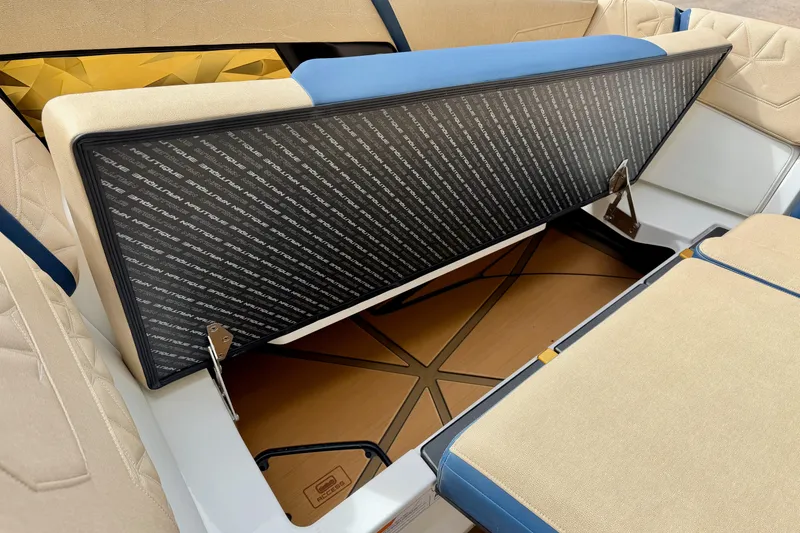 Slide: The Image of 2025 Nautique Super Air Nautique G25 Paragon interior storage compartment with luxurious seating. - 30