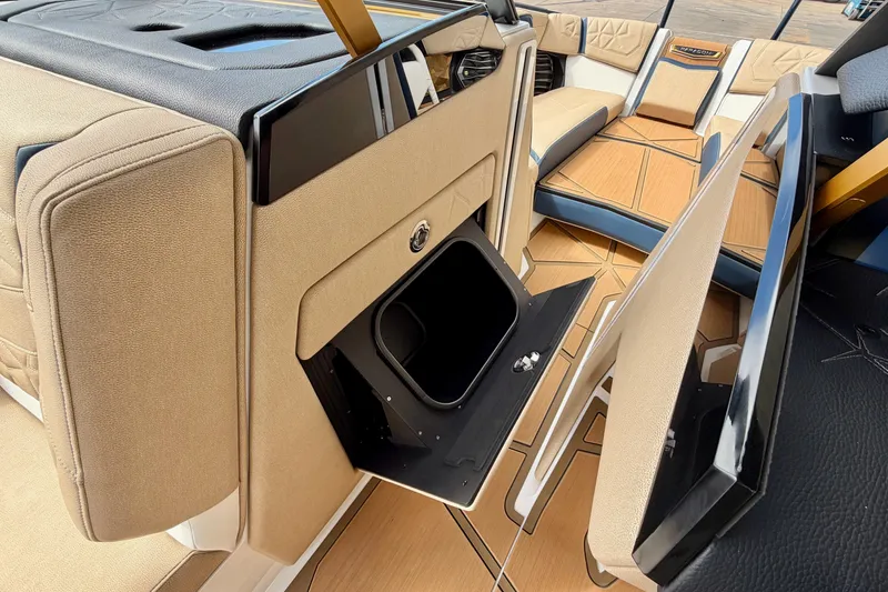 Slide: The Image of Interior of 2025 Nautique Super Air Nautique G25 Paragon, featuring luxurious seating and storage. - 34