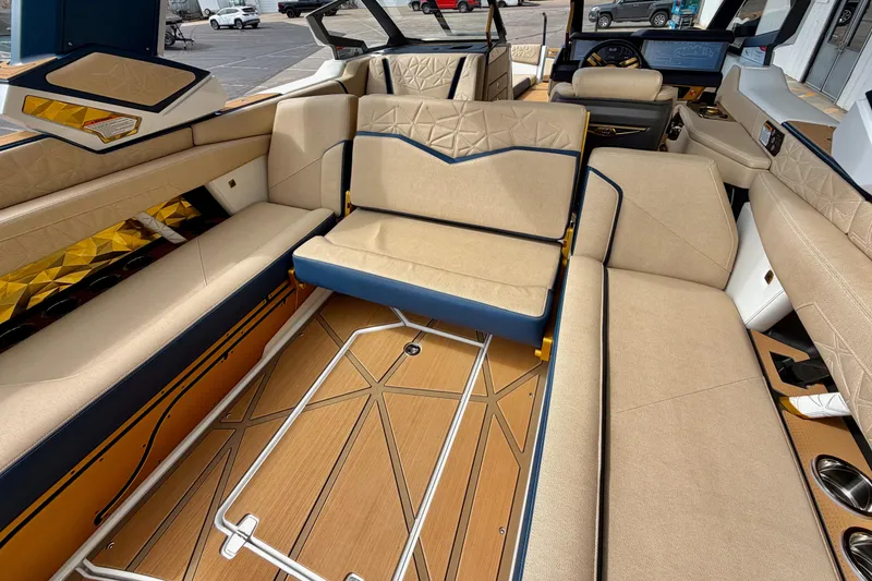 Slide: The Image of Luxurious interior of 2025 Nautique Super Air Nautique G25 Paragon boat with beige seating. - 35