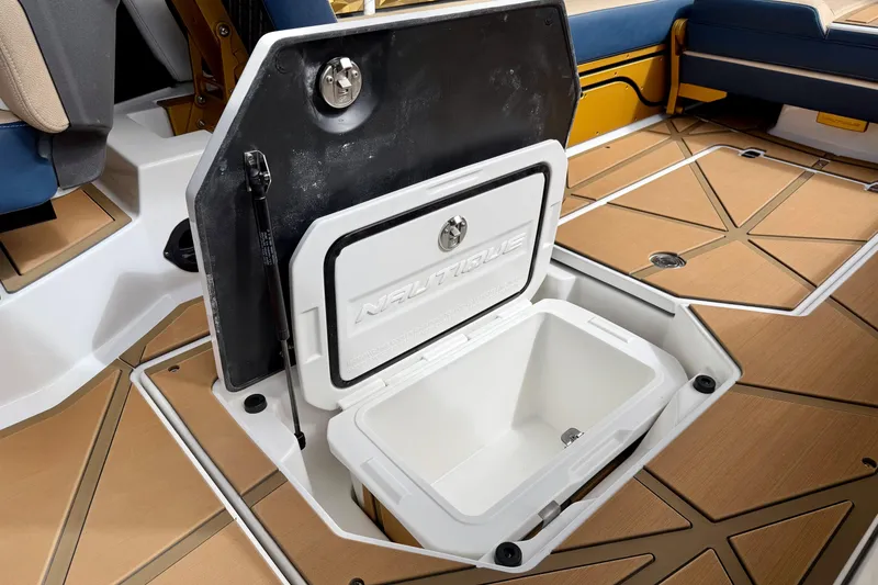 Slide: The Image of 2025 Nautique Super Air Nautique G25 Paragon storage compartment with open hatch. - 36