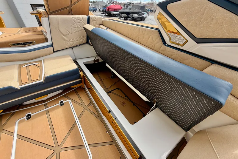 Slide: The Image of 2025 Nautique Super Air Nautique G25 Paragon interior with open storage compartment. - 37
