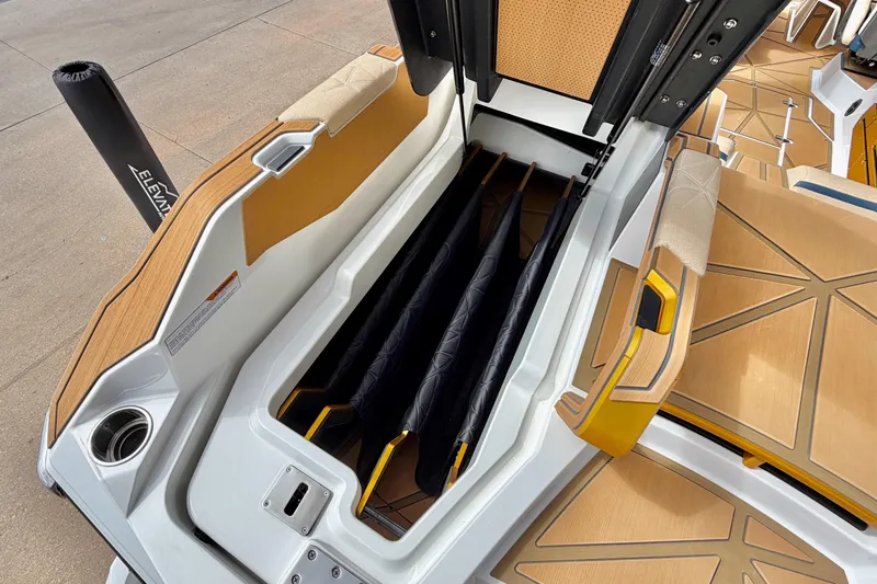 Slide: The Image of 2025 Nautique Super Air Nautique G25 Paragon storage compartment with sleek design and premium materials. - 42