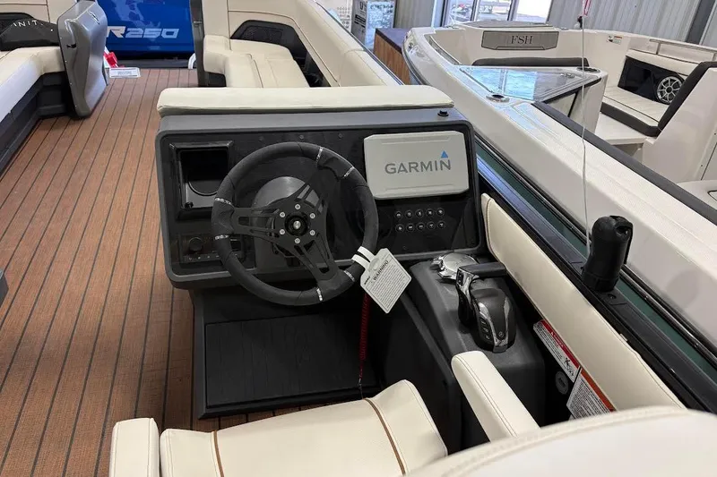 Slide: The Image of 2023 Manitou EXPLORE 26 SHP 575 boat interior with Garmin navigation system. - 10