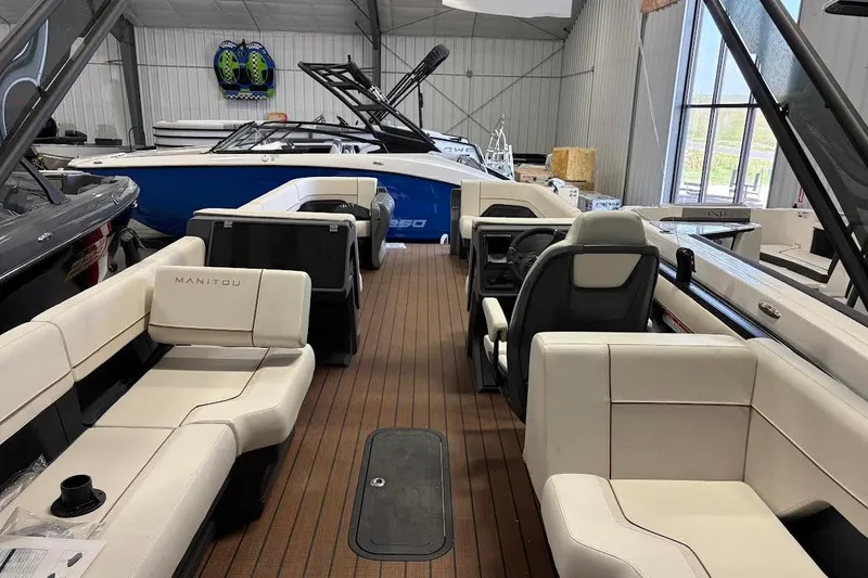 Slide: The Image of 2023 Manitou EXPLORE 26 SHP 575 boat interior with luxurious seating and modern design. - 5