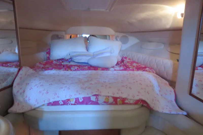 Slide: The Image of Cozy cabin interior of 2001 Sea Ray 340 Sundancer with floral bedding. - 13