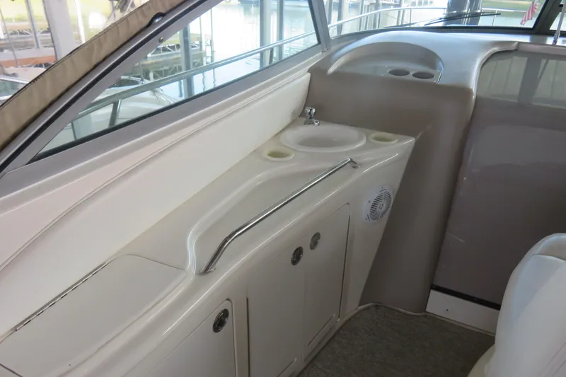 Slide: The Image of 2001 Sea Ray 340 Sundancer interior with sink and storage area. - 4
