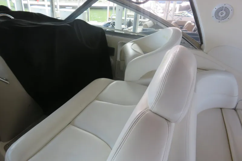 Slide: The Image of Interior of 2001 Sea Ray 340 Sundancer with white leather seating and window view. - 5