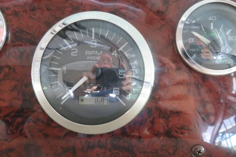 Slide: The Image of Close-up of 2001 Sea Ray 340 Sundancer RPM gauge, showing 1687 hours. - 8