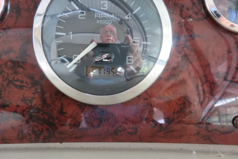 Slide: The Image of Close-up of 2001 Sea Ray 340 Sundancer RPM gauge, showing 1195 hours. - 9