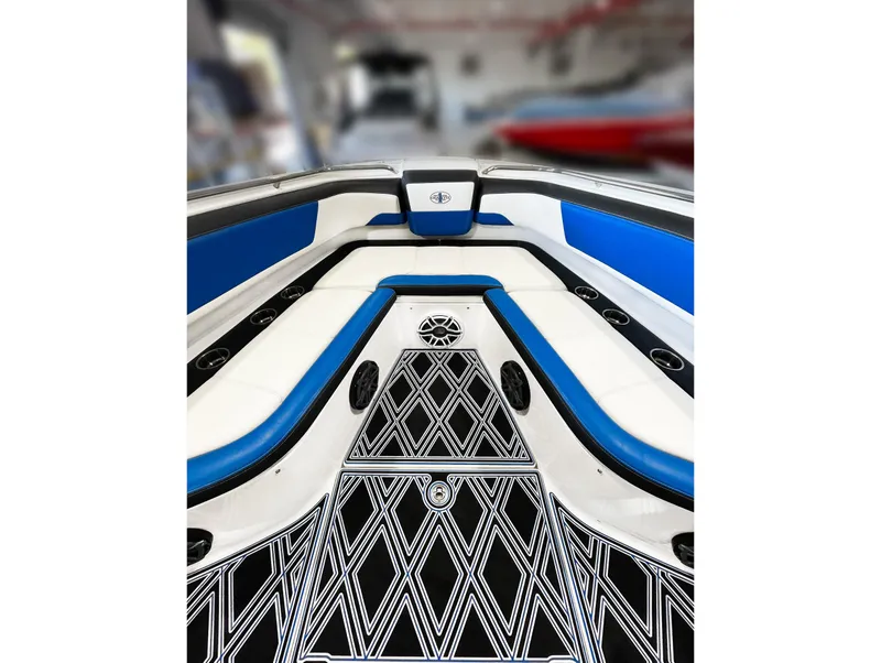 Slide: The Image of 2018 Cigarette GTO boat interior with blue and white seating and patterned flooring. - 2