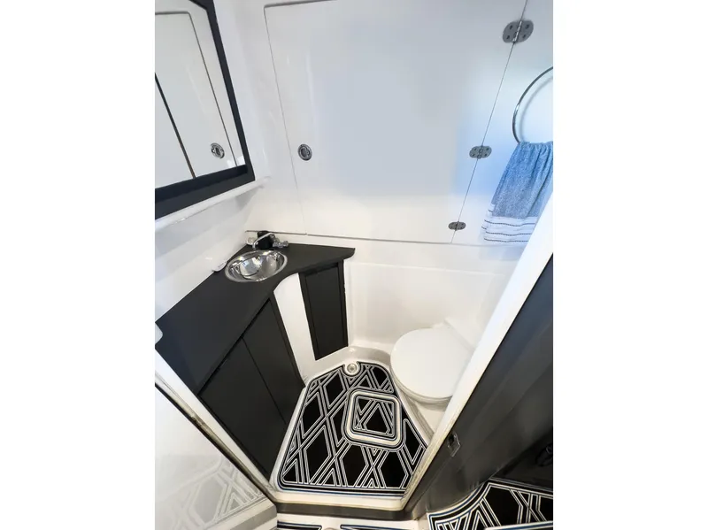Slide: The Image of Modern 2018 Cigarette GTO boat bathroom with sleek design and geometric rug. - 5