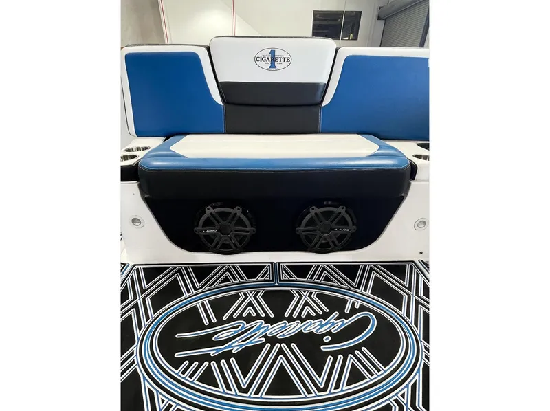 Slide: The Image of 2018 Cigarette GTO boat interior with blue and white seating and custom flooring. - 9