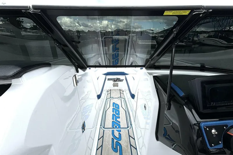 Slide: The Image of 2020 Scarab 255 ID Wake boat interior with sleek design and modern dashboard. - 26