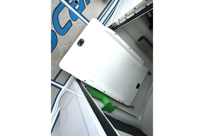Slide: The Image of 2020 Scarab 255 ID Wake boat interior with storage compartment and seating area. - 34