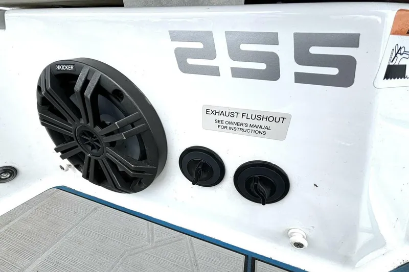 Slide: The Image of 2020 Scarab 255 ID Wake boat with Kicker speaker and exhaust flushout panel. - 39