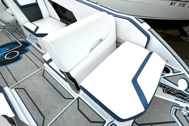 Slide: The Image of 2020 Scarab 255 ID Wake boat interior with white and blue seating and stylish flooring. - 13