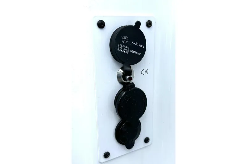 Slide: The Image of Audio and USB input panel on 2020 Scarab 255 ID Wake boat. - 47