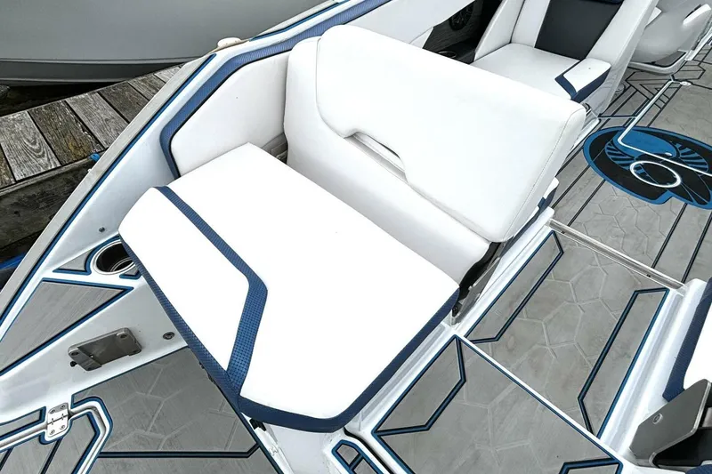 Slide: The Image of 2020 Scarab 255 ID Wake boat interior with white and blue seating and stylish flooring. - 12