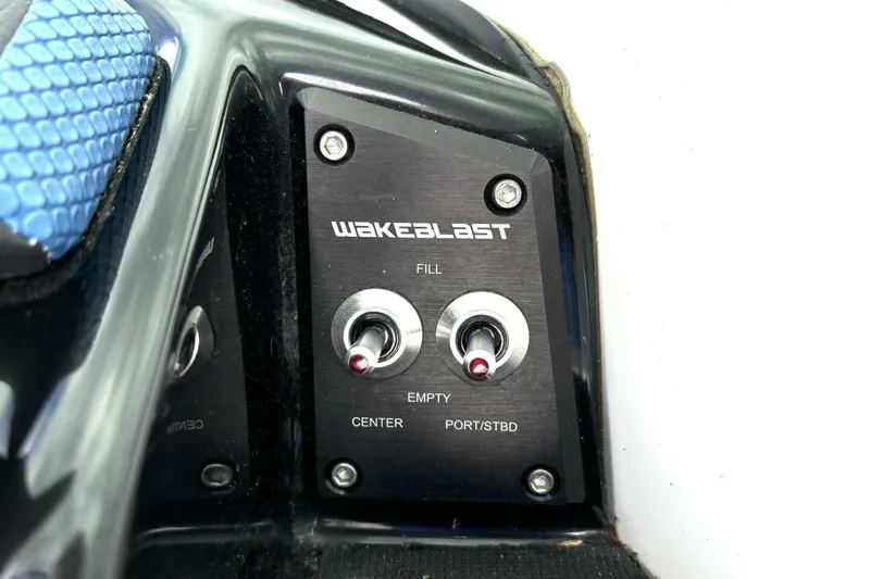 Slide: The Image of Control panel of 2020 Scarab 255 ID Wake boat with Wakeblast switches. - 24