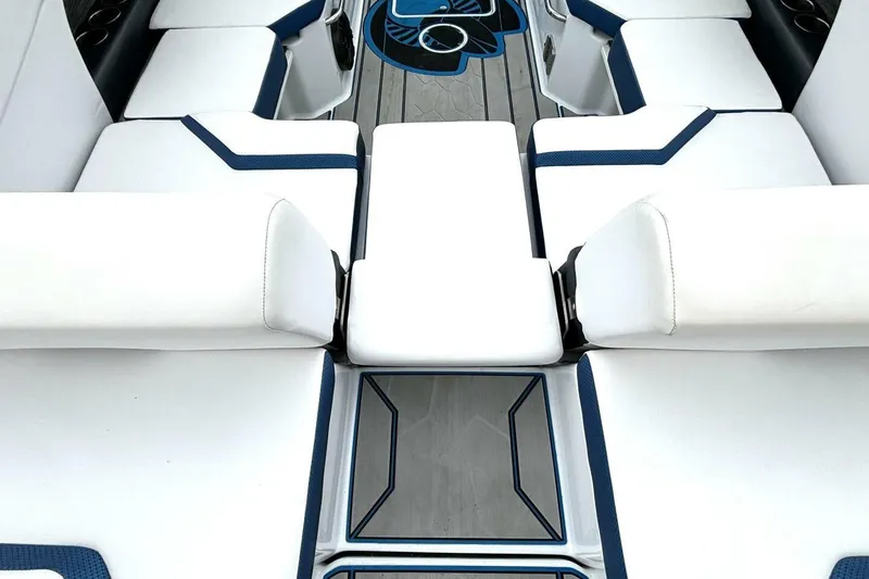 Slide: The Image of 2020 Scarab 255 ID Wake boat interior with white and blue seating. - 14
