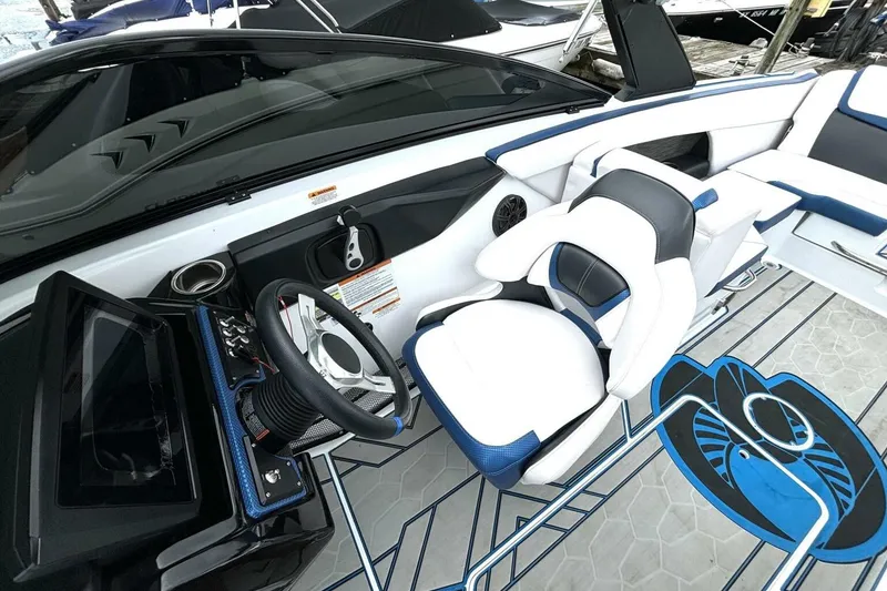 Slide: The Image of 2020 Scarab 255 ID Wake boat interior with modern steering and seating design. - 20