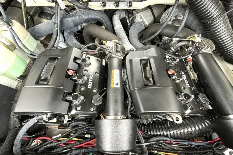 Slide: The Image of Engine compartment of a 2020 Scarab 255 ID Wake boat with Rotax engines. - 43