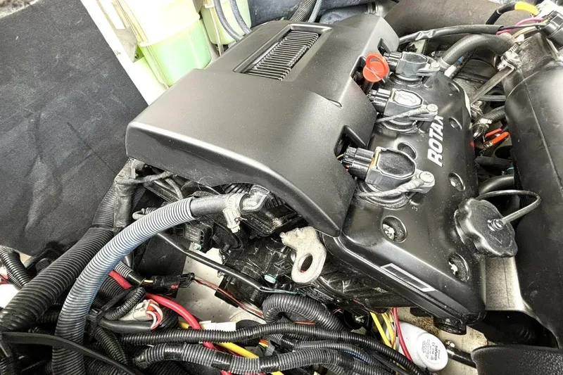 Slide: The Image of Engine compartment of 2020 Scarab 255 ID Wake boat, featuring Rotax engine components. - 42