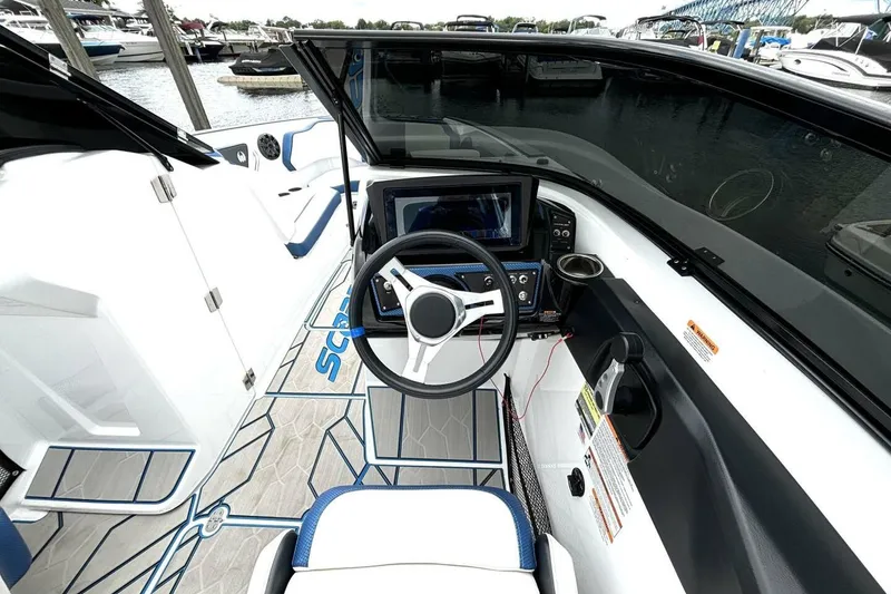 Slide: The Image of 2020 Scarab 255 ID Wake boat interior with steering wheel and dashboard controls. - 22