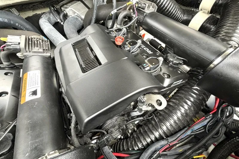 Slide: The Image of Engine compartment of 2020 Scarab 255 ID Wake boat, showcasing detailed components. - 41