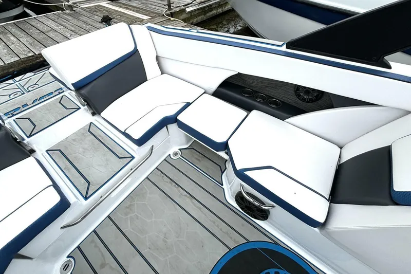Slide: The Image of 2020 Scarab 255 ID Wake boat interior with white and blue seating. - 16