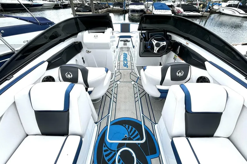 Slide: The Image of 2020 Scarab 255 ID Wake boat interior with sleek seating and modern dashboard design. - 17