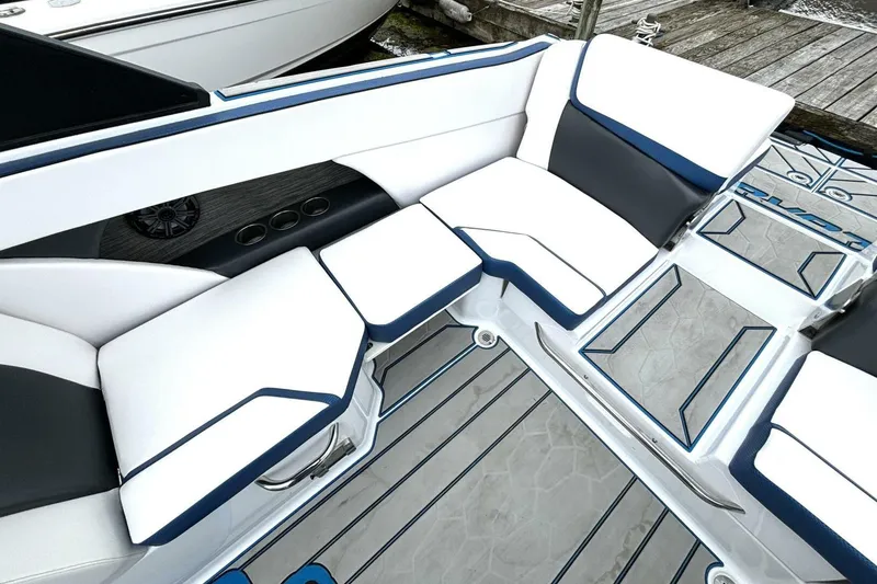 Slide: The Image of 2020 Scarab 255 ID Wake boat interior with white and blue seating. - 15